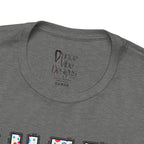 Close-up of a t-shirt's inner neck label with the brand Dance Vibe Designs printed above the care instructions.