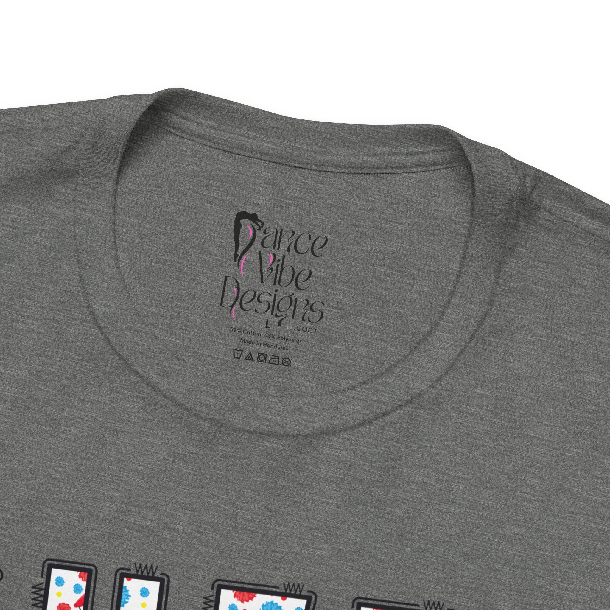 Close-up of a t-shirt's inner neck label with the brand Dance Vibe Designs printed above the care instructions.