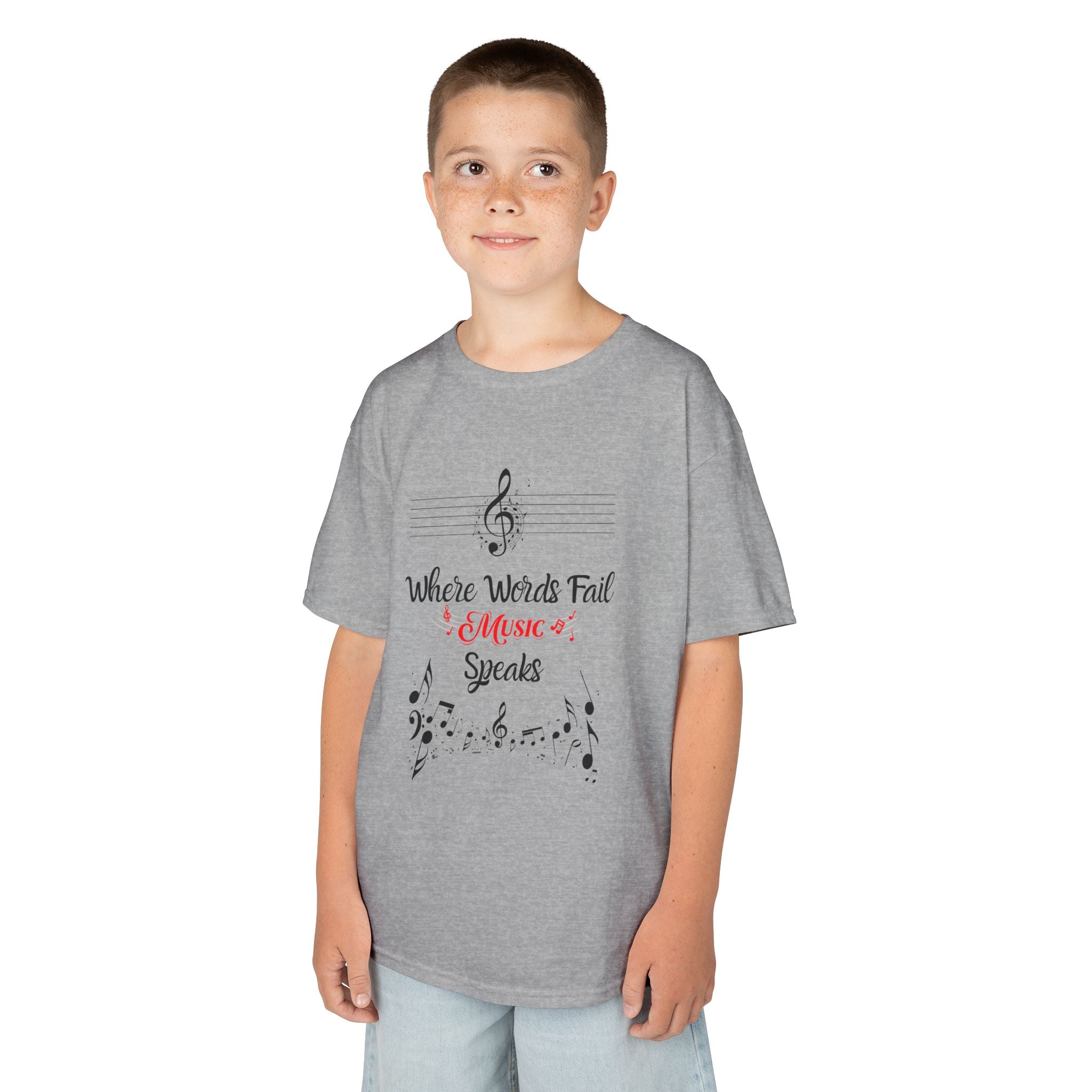 Young boy wearing a youth Gildan 5000B heavy cotton t-shirt in sport grey with a Where Words Fail Music Speaks text and graphic