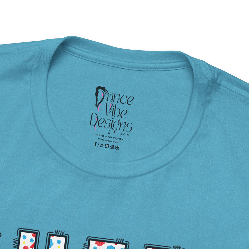 Close-up of a t-shirt's inner neck label with the brand Dance Vibe Designs printed above the care instructions.