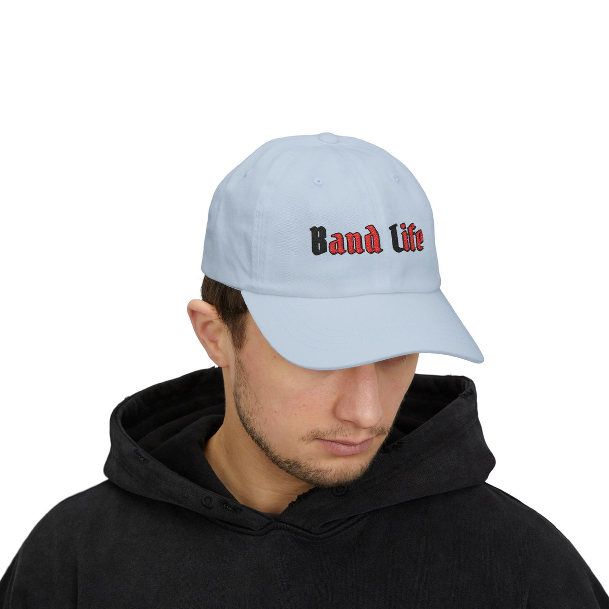 Man wearing a light blue embroidered classic dad cap hat with Band Life text