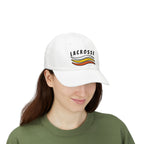 Woman wearing a white embroidered classic dad cap hat with a Lacrosse text and graphic