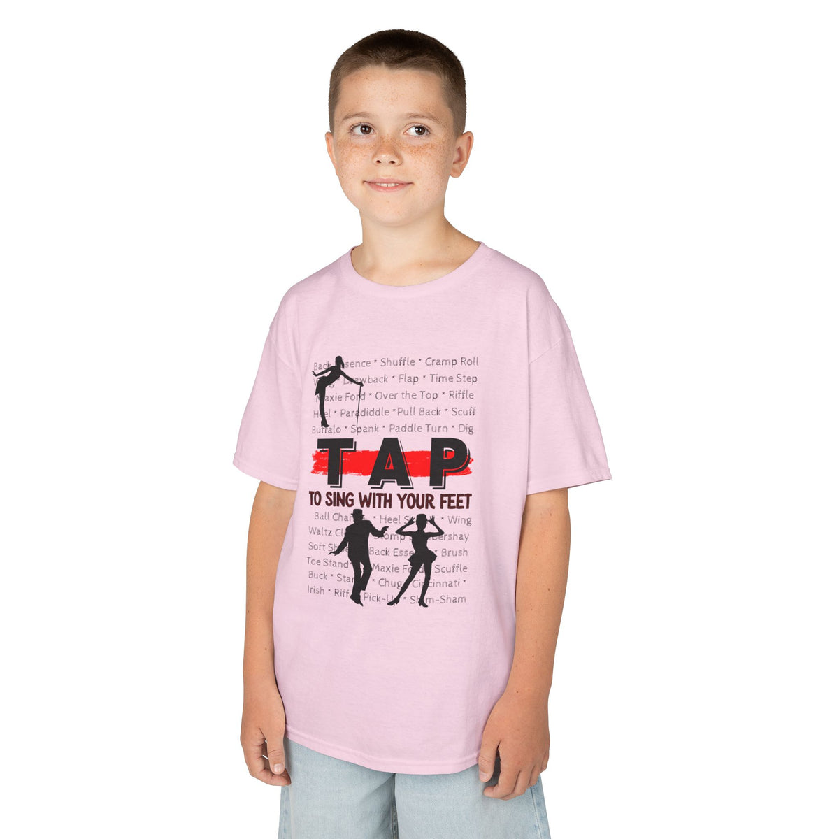 Young boy wearing a youth Gildan 5000B heavy cotton t-shirt in light pink with a Tap text and design