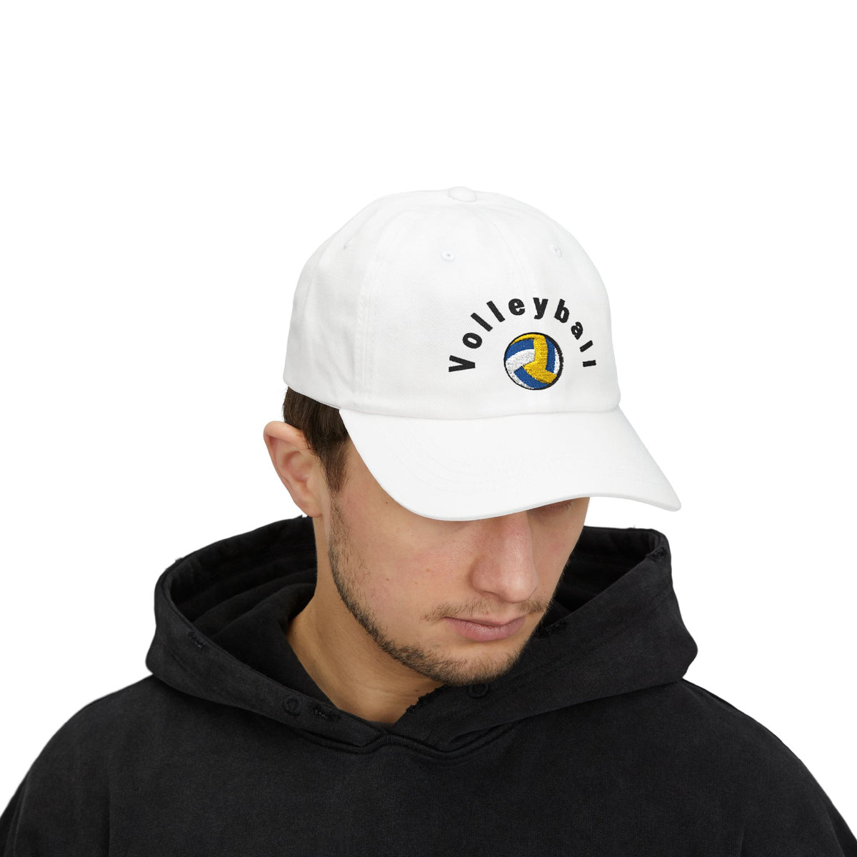 Man wearing a white embroidered classic dad cap hat with a Volleyball text and graphic