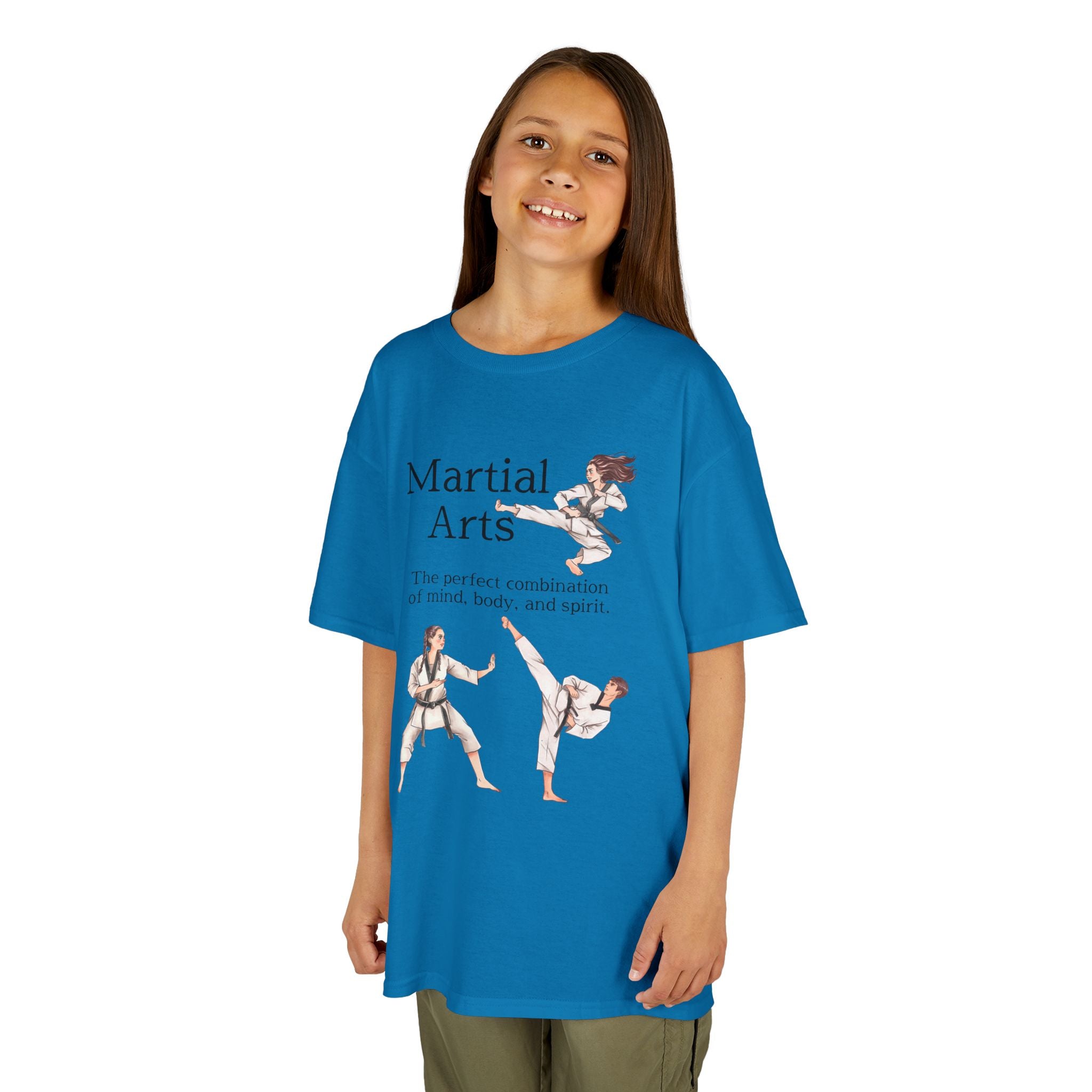 Young girl wearing a youth Gildan 5000B heavy cotton t-shirt in sapphire with a Martial Arts text and graphic