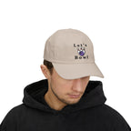 Man wearing a stone embroidered classic dad cap hat with Let's Bowl text and graphic