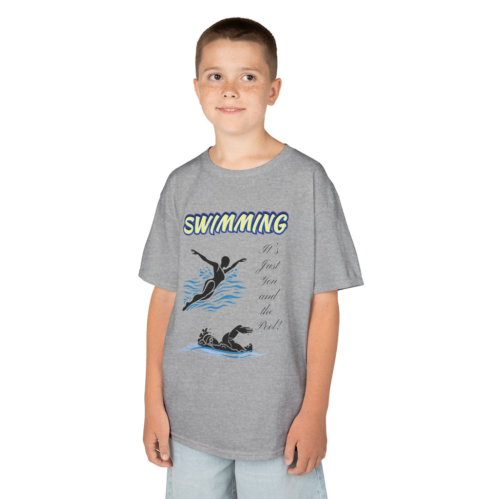 Young boy wearing a youth Gildan 5000B heavy cotton t-shirt in sport grey with a Swimming text and graphic