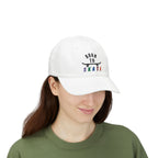 Woman wearing a white baseball cap featuring a graphic on the front that reads BORN TO SKATE with a black skateboard silhouette and colorful lettering for SKATE.