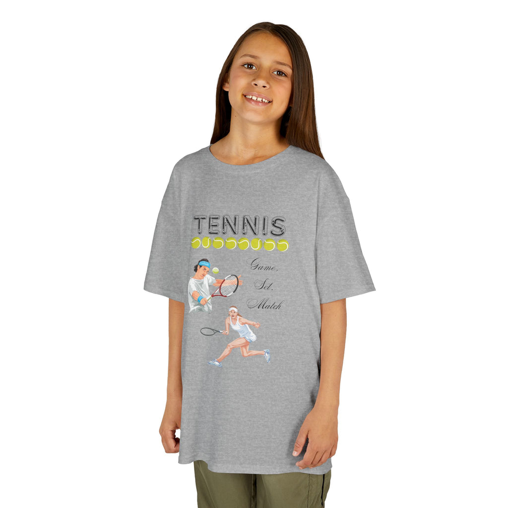 Young girl wearing a youth Gildan 5000B heavy cotton t-shirt in sport grey with a Tennis text and graphic