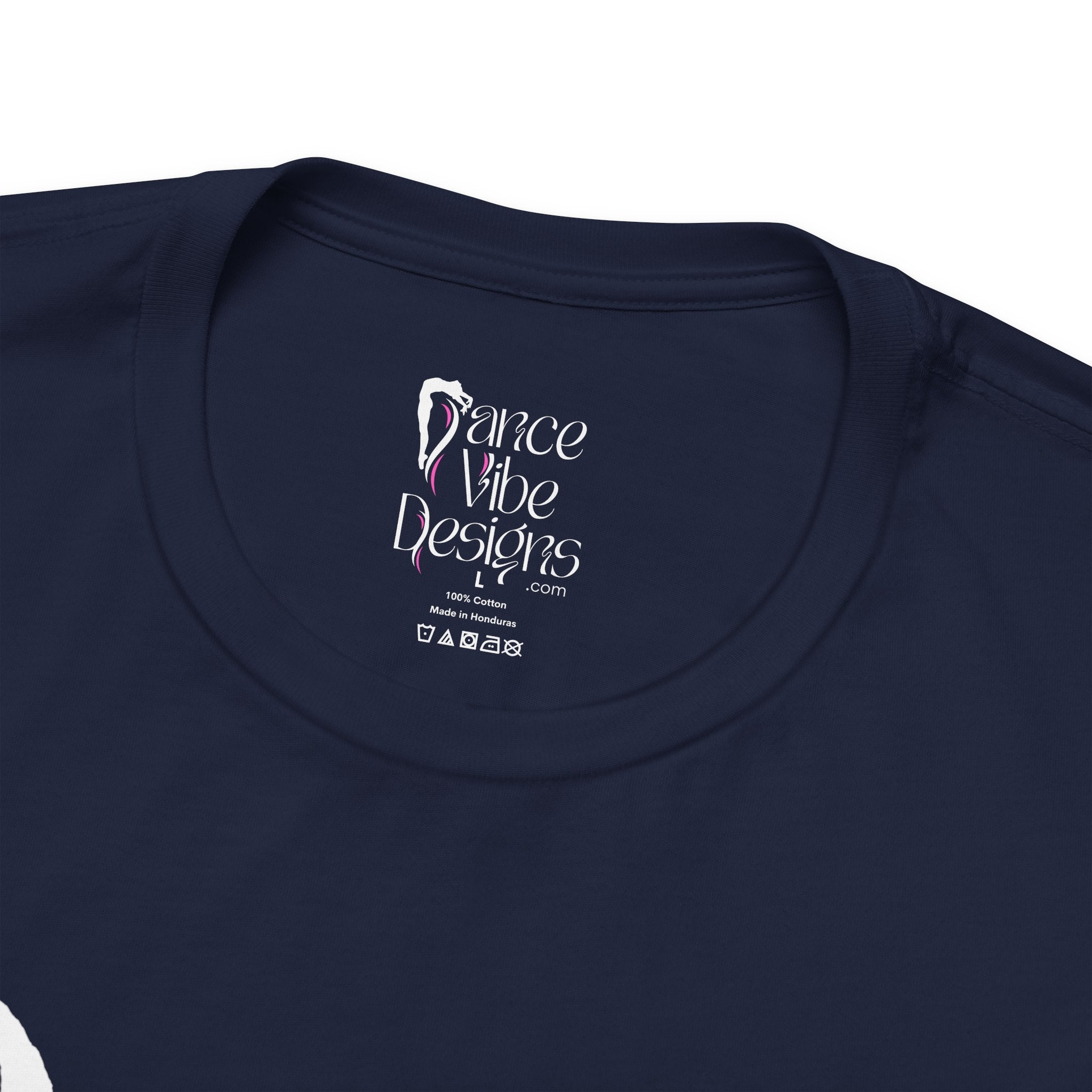 Close-up of a crewneck t-shirt showing the inner neck label with the Dance Vibe Designs logo above the care instructions.
