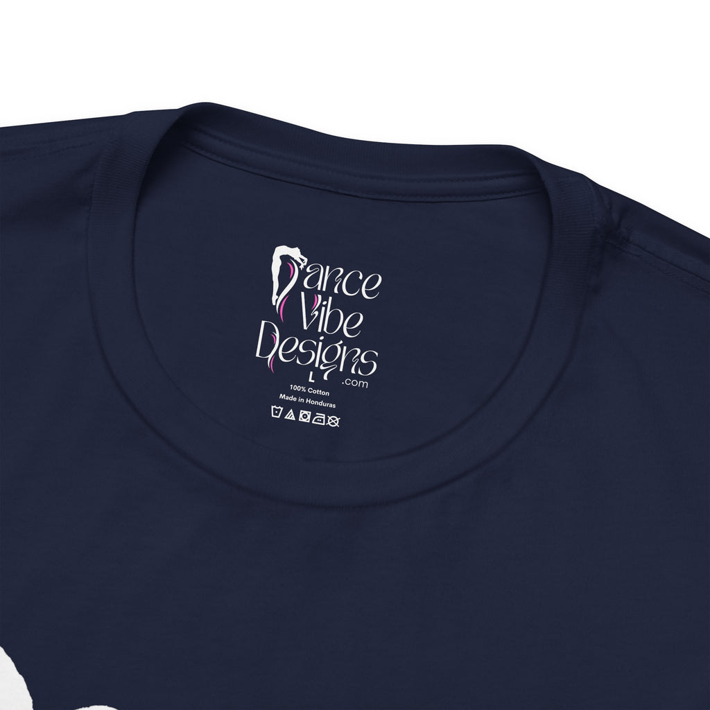 Close-up of a crewneck t-shirt showing the inner neck label with the brand Dance Vibe Designs printed above the care instructions.