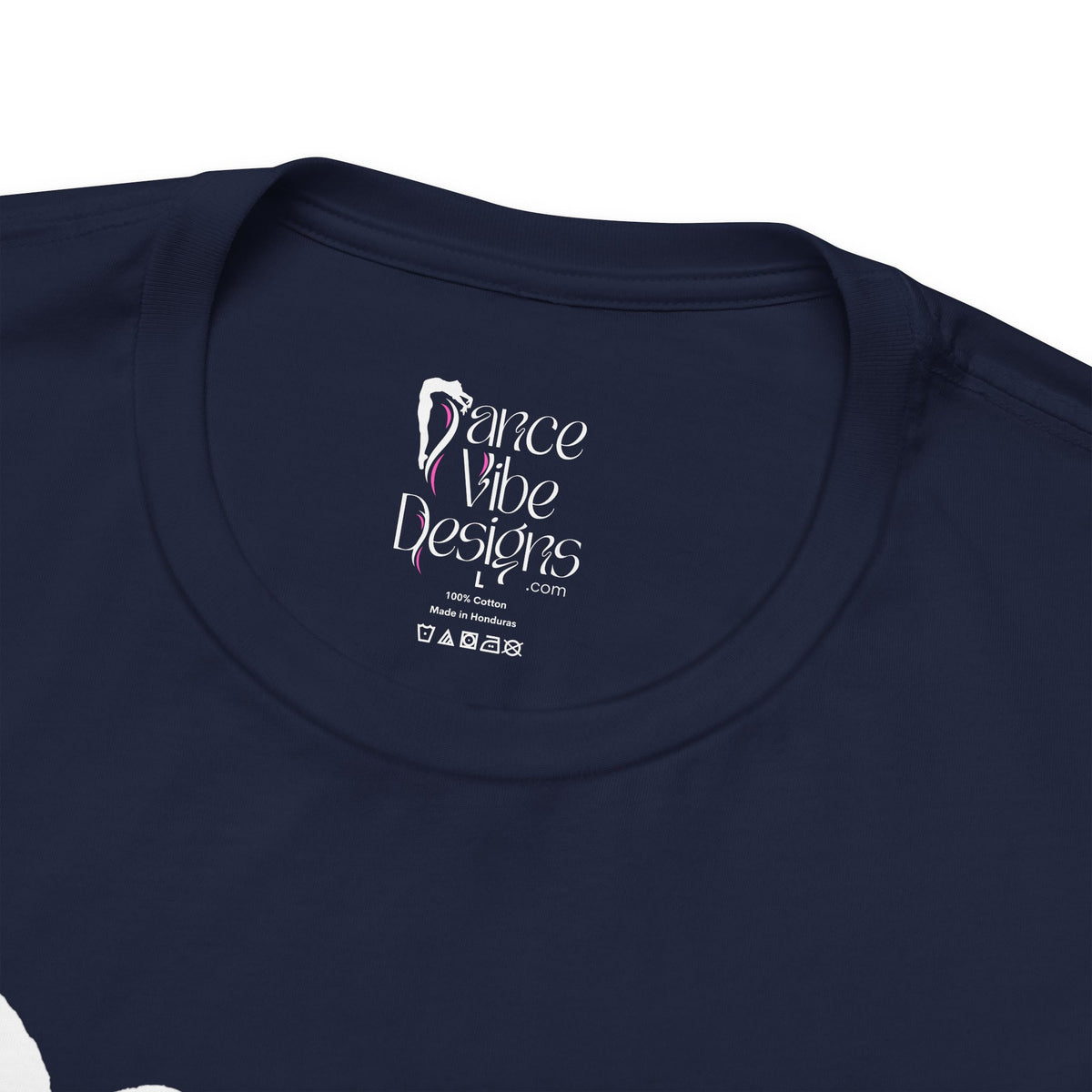 Close-up of a crewneck t-shirt showing the inner neck label with the brand Dance Vibe Designs printed above the care instructions.