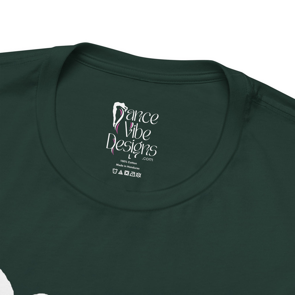 Close-up of a crewneck t-shirt showing the inner neck label with the Dance Vibe Designs logo above the care instructions.