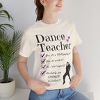 Woman wearing a natural short-sleeve graphic t-shirt featuring the text Dance Teacher with a jazz, hip hop dancer silhouette.