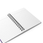 Open spiral-bound notebook with white lined pages.
