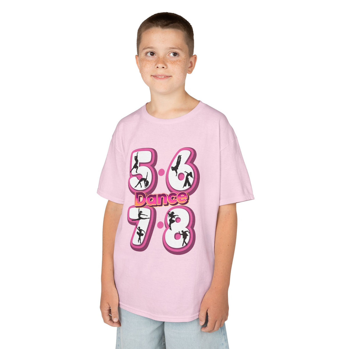 Young boy wearing a Gildan 5000B heavy cotton t-shirt in light pink with a 5678 Dance text and graphic