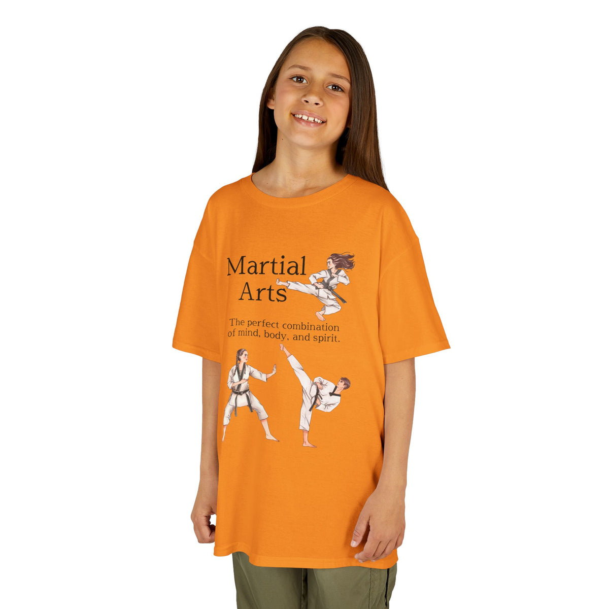 Young girl wearing a youth Gildan 5000B heavy cotton t-shirt in tennessee orange with a Martial Arts text and graphic