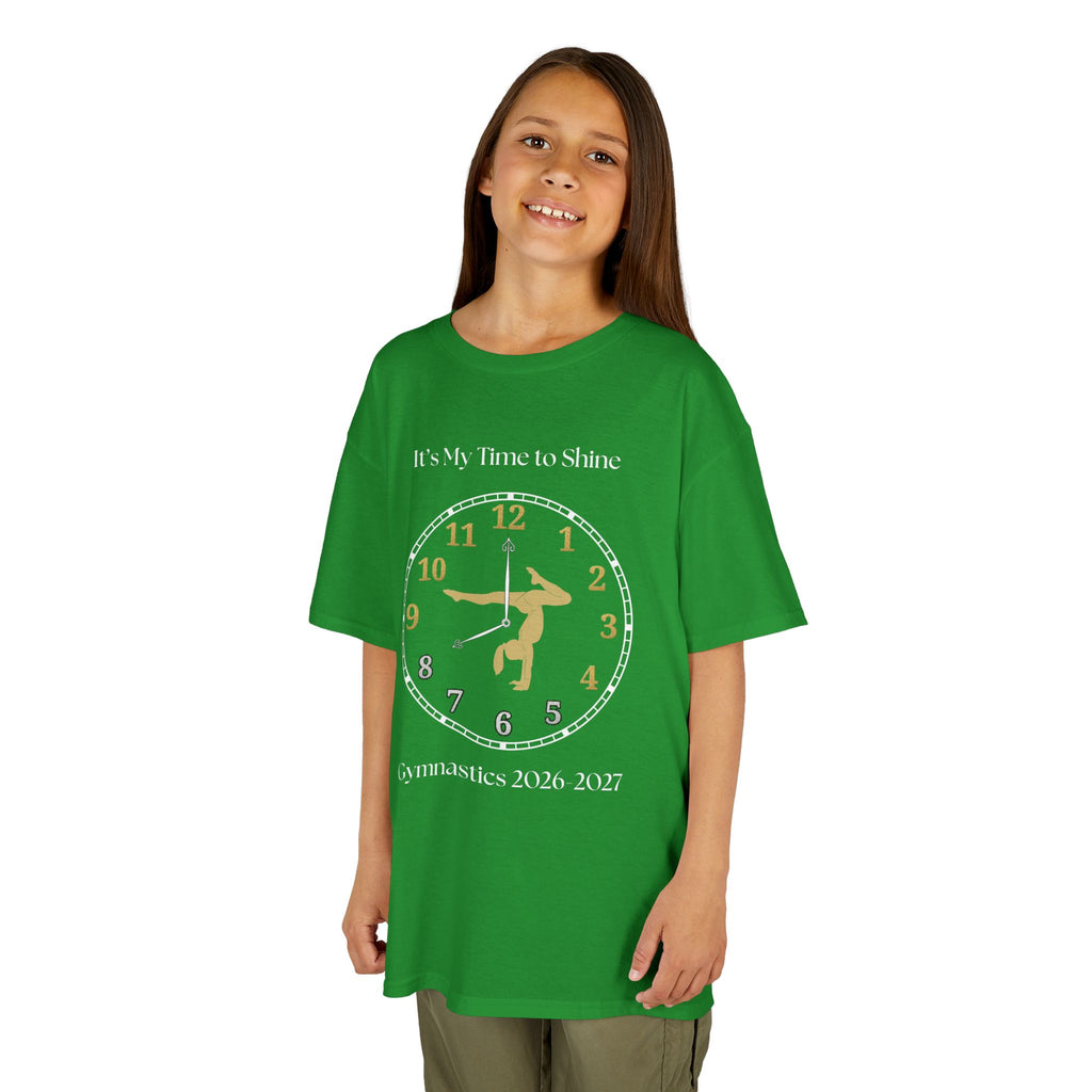 Young girl wearing a youth Gildan 5000B heavy cotton t-shirt in irish green with an It's My Time to Shine Gymnastics 2026-2027 theme