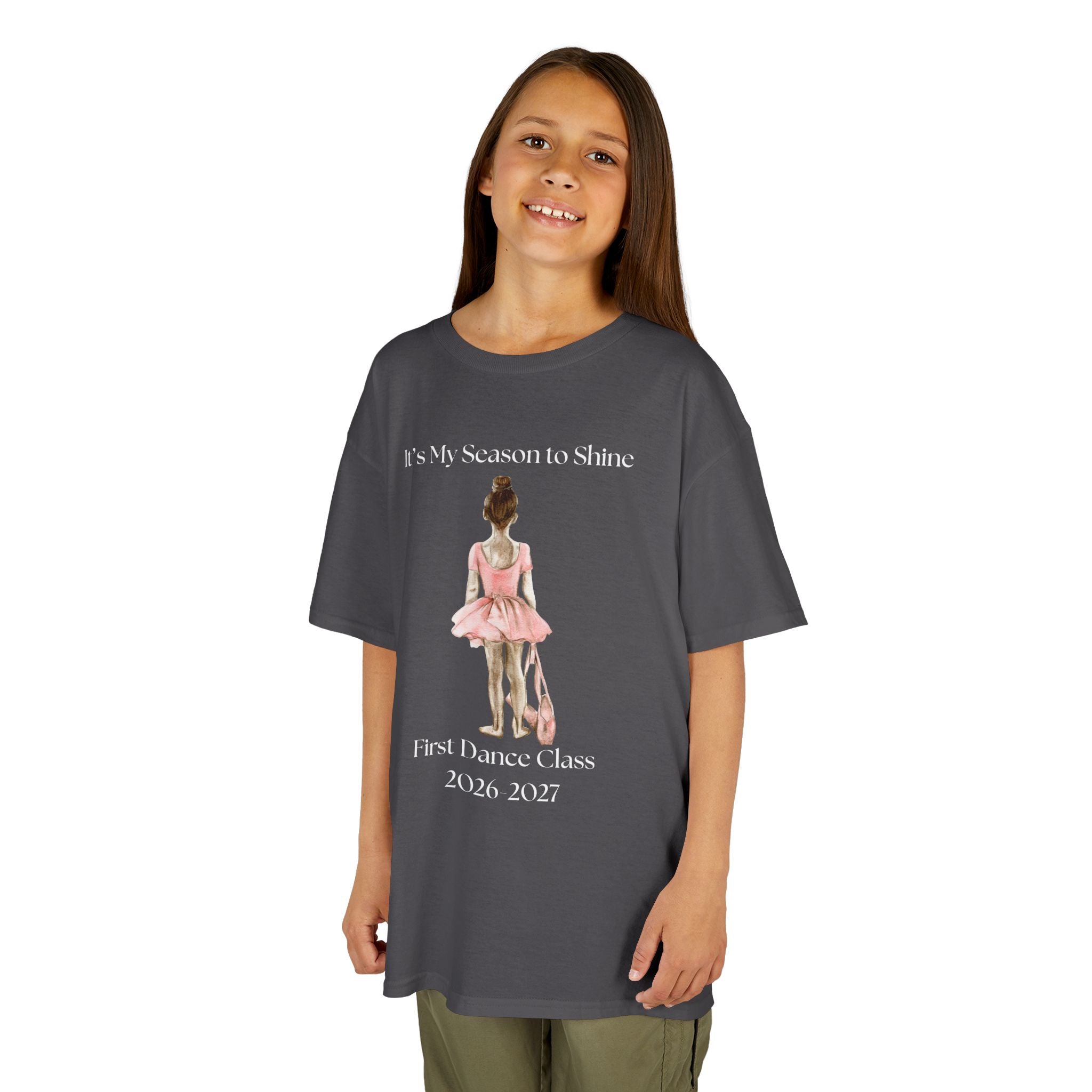Young girl wearing a youth Gildan 5000B heavy cotton t-shirt in sport grey with a First Dance Class theme
