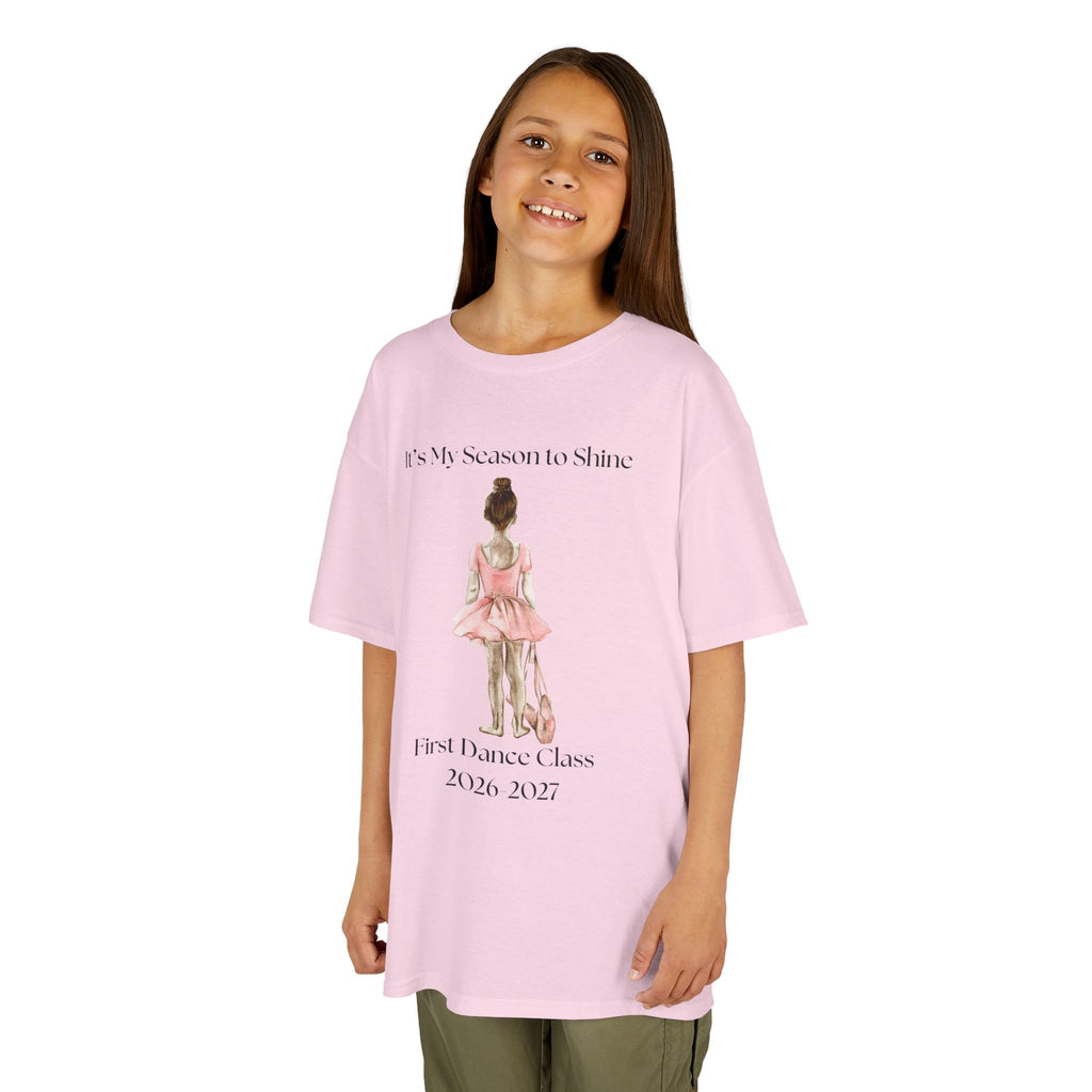 Young girl wearing a youth Gildan 5000B heavy cotton t-shirt in light pink with a First Dance Class theme